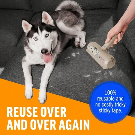 A man uses a reusable ChomChom Home Limited Edition Dog Roller to remove hair from a dark sofa where his husky is lying. The advertising copy reads, "REUSE OVER AND OVER AGAIN" and "100% reusable and no costly tricky sticky tape."